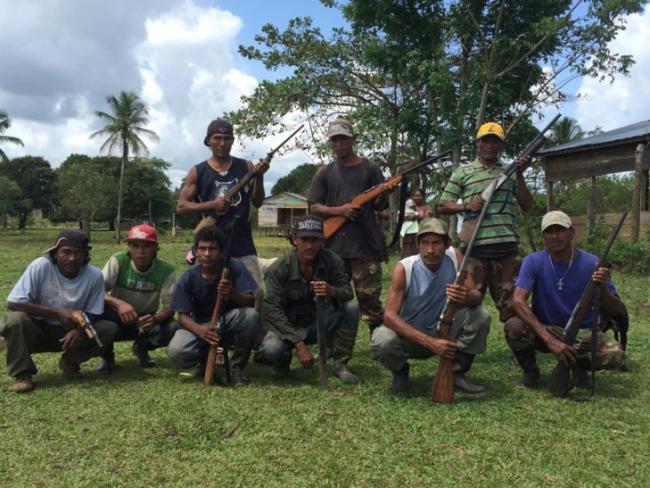 image from Wikimedia Commons of "Miskito men organized for community defense in Nicaragua's Caribbean region" credited to Courtney Parker, the original photographer in 2016)